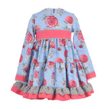 Vestido niña fondo celeste y flor buganvilla  de La Ormiga.