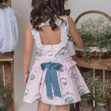 Vestido niña rosa estampado con mariposas de Atelier de Candela.